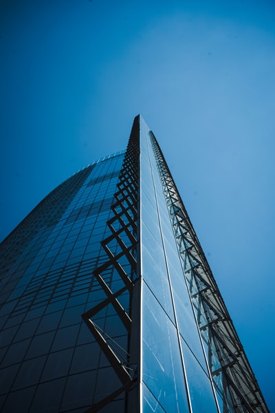 Grey concrete building under the blue sky during the day
